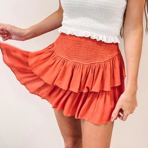 Mustard Seed Smocked Ruffle Mini Skirt with Shorts Rust